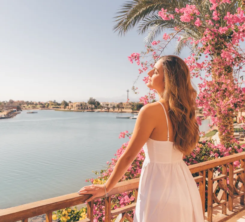 a lady enjoying the sun and lagoon view.