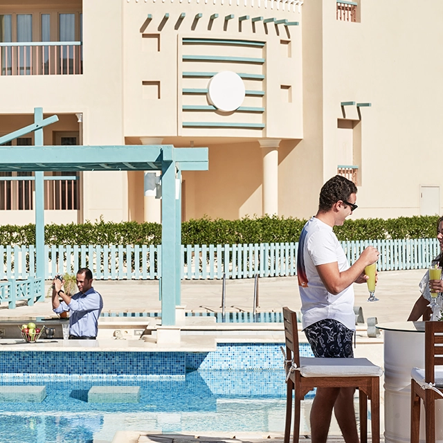 The poolside bar, offering drinks and relaxation in a serene setting.