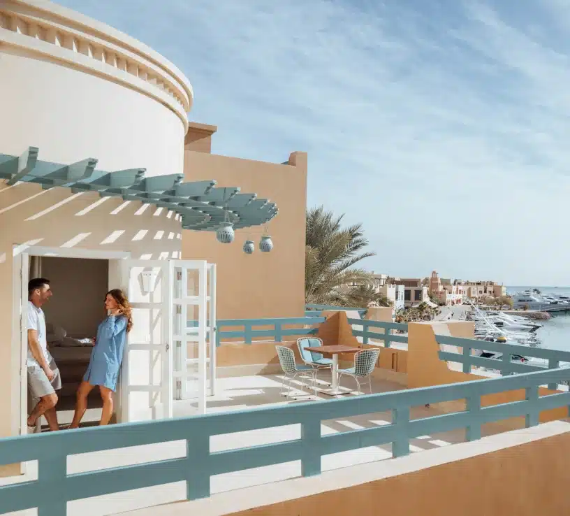 couple on terrace overviewing red sea and abu tig marina el gouna